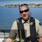 An official from Folly Beach on a boat.