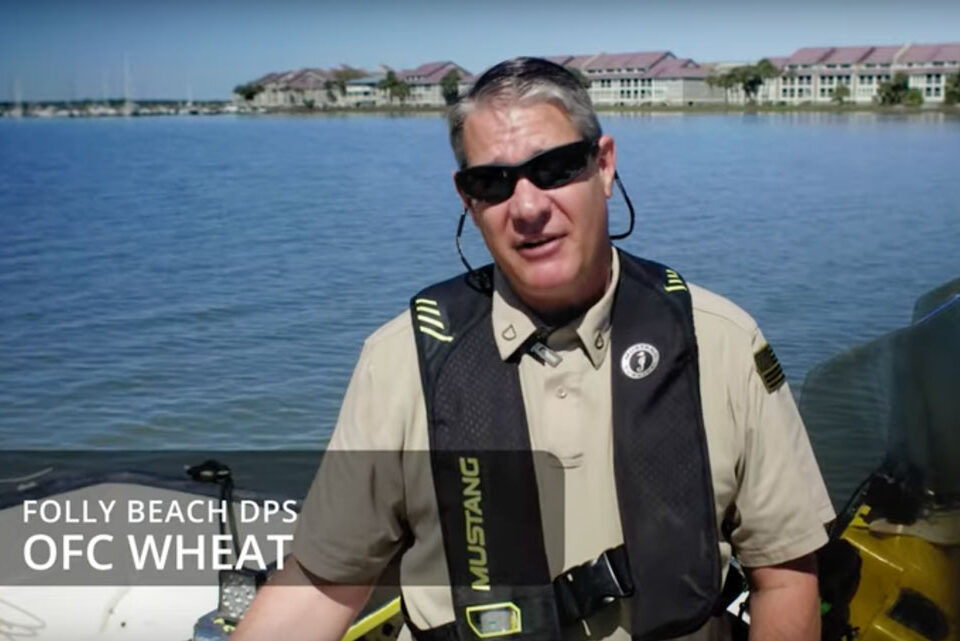 An official from Folly Beach on a boat.