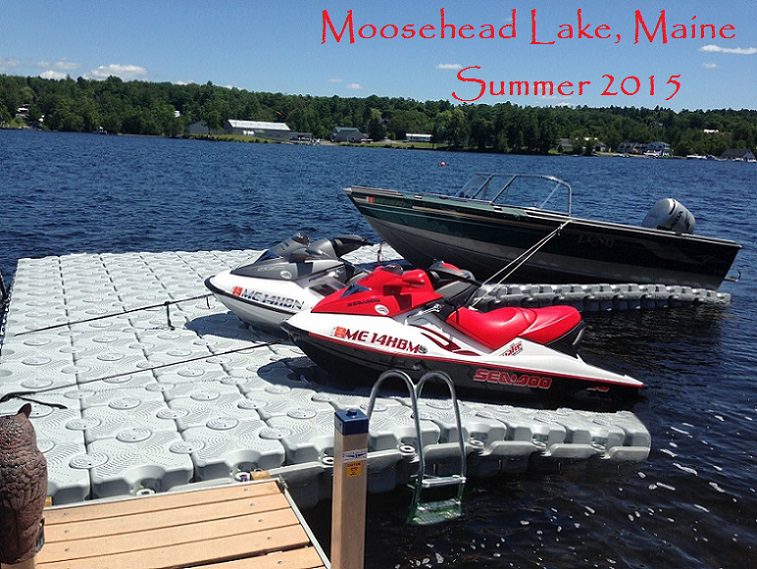 Two jet skis and a boat sit on top of a custom floating dock with the text: "Moosehead Lake, Maine. Summer 2015" superimposed.